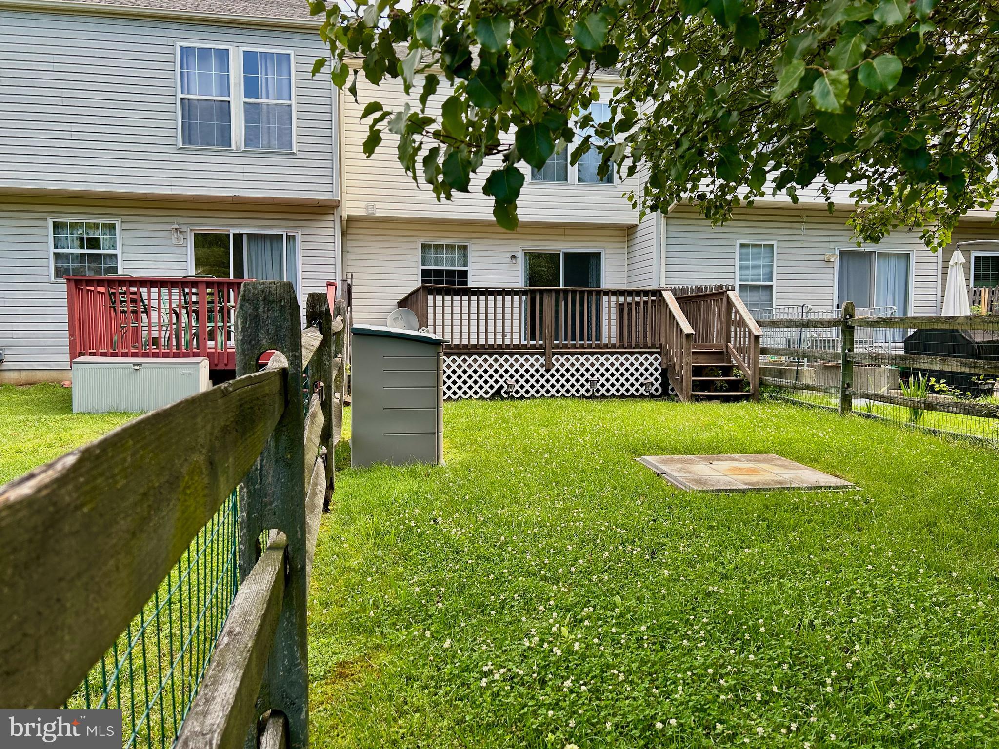 55 Alexis Drive Newark, DE 19702 - Photo 27 of 27 a front view of a house with garden and patio