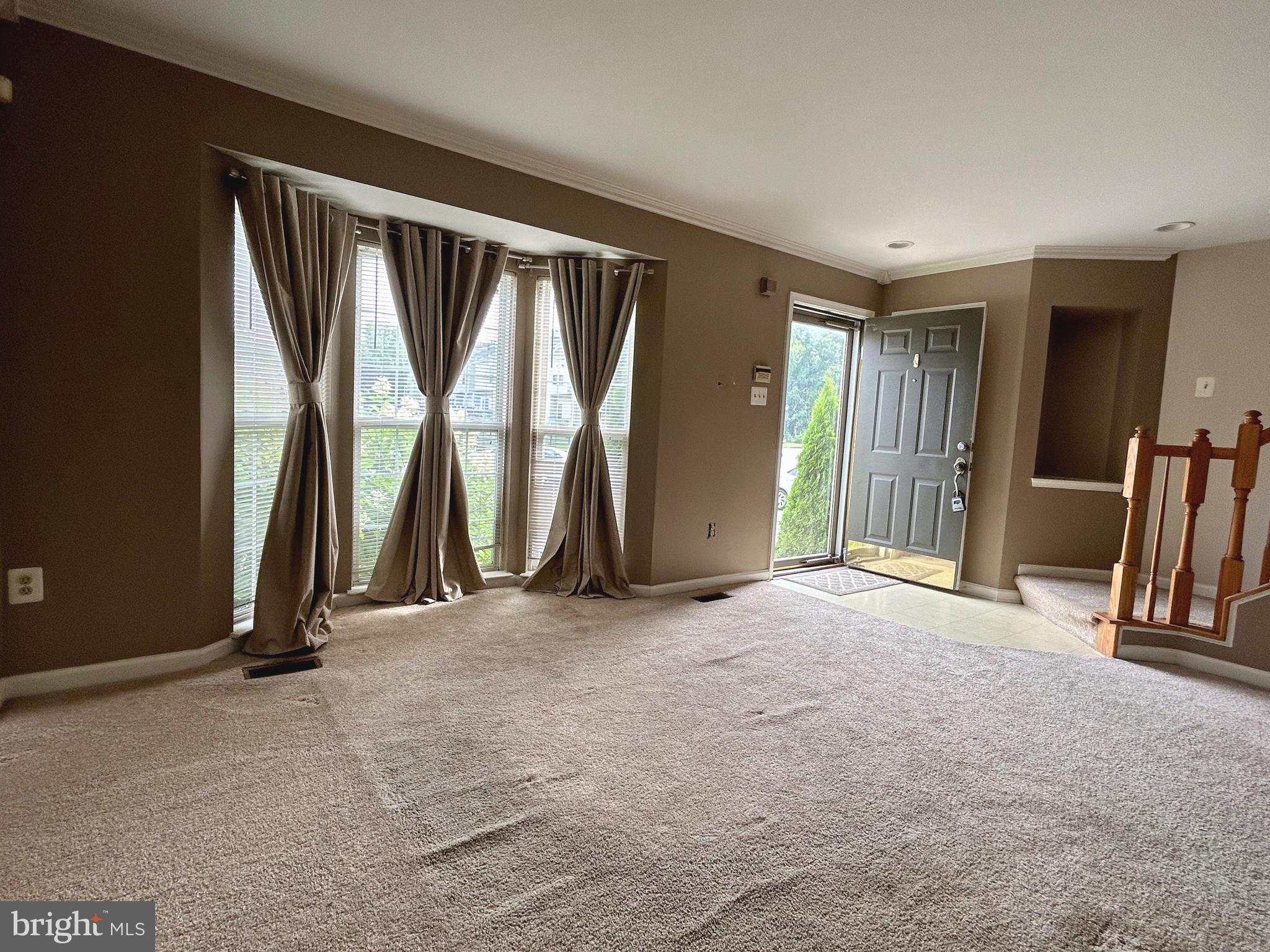 55 Alexis Drive Newark, DE 19702 - Photo 5 of 27 an empty room with windows