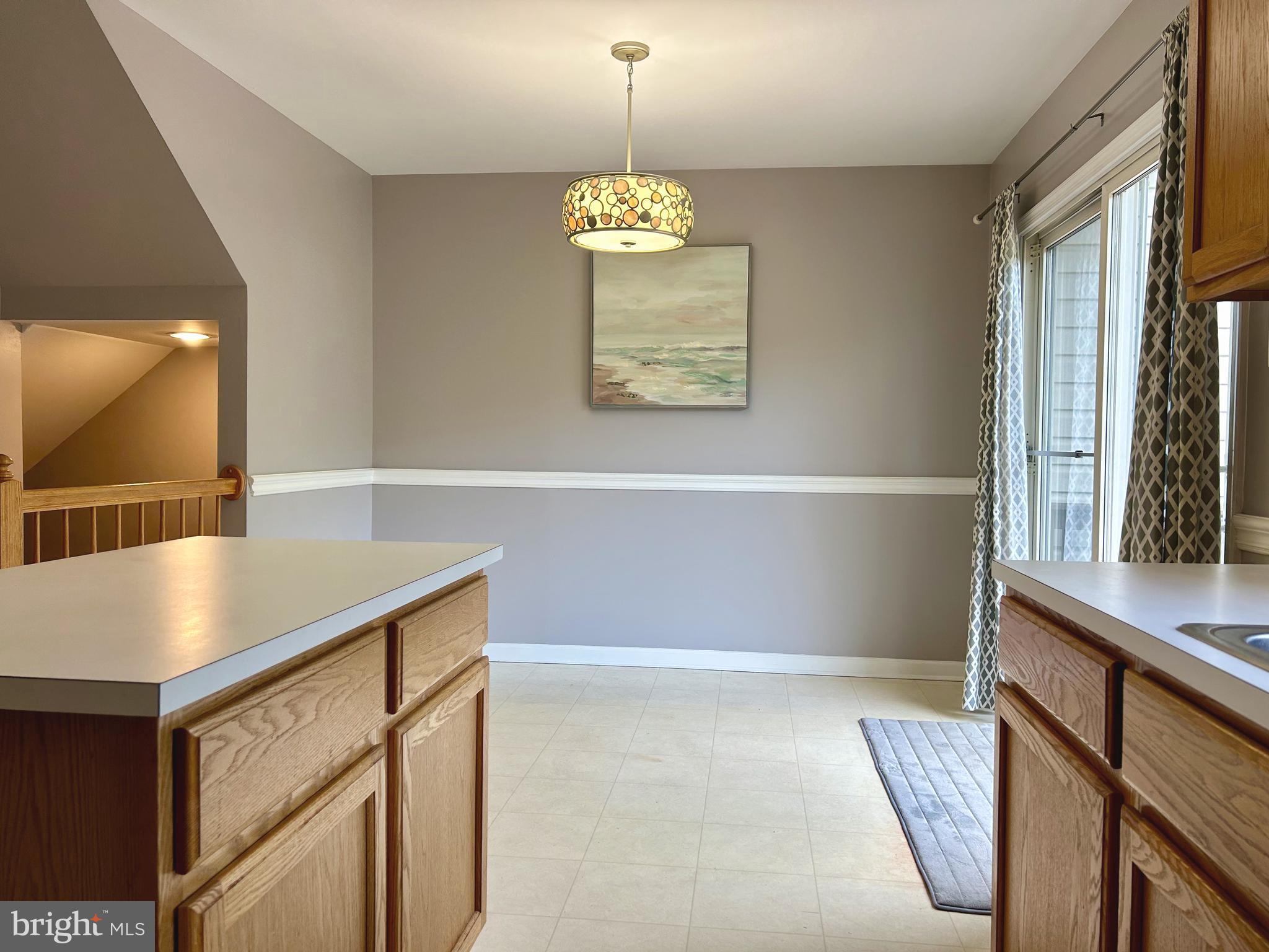 55 Alexis Drive Newark, DE 19702 - Photo 8 of 27 a view of kitchen with furniture wooden floor and window