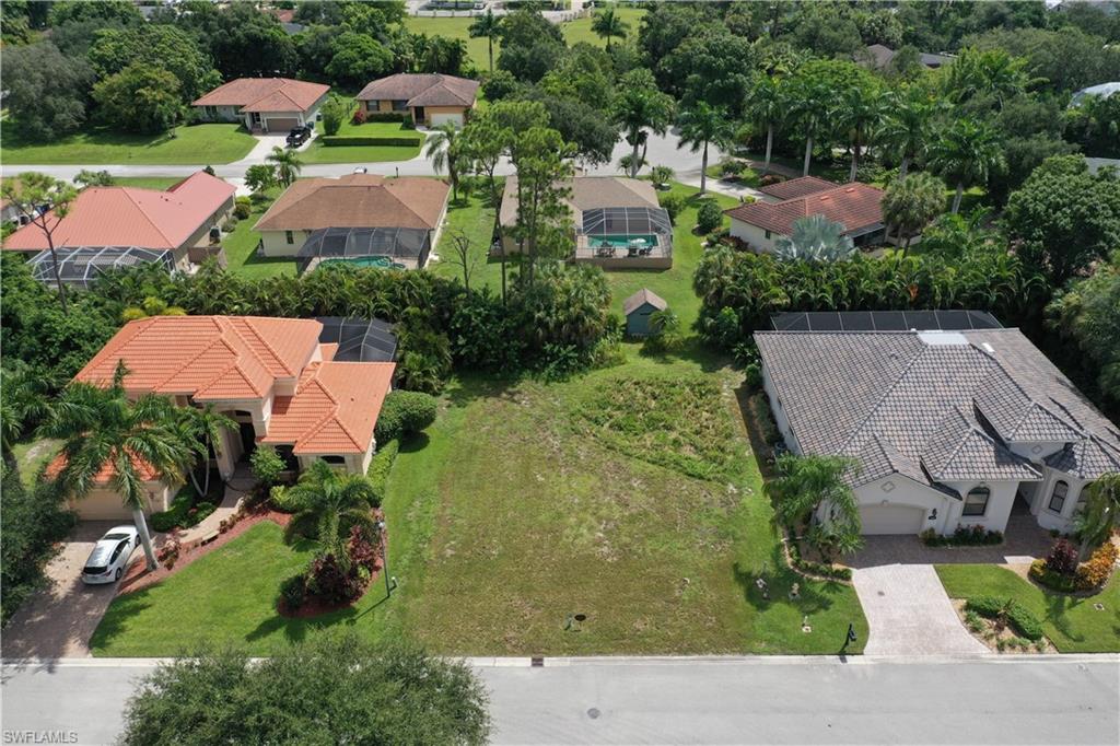 27085 Serrano Way Bonita Springs, FL 34135 - Photo 4 of 8 an aerial view of house with yard and swimming pool