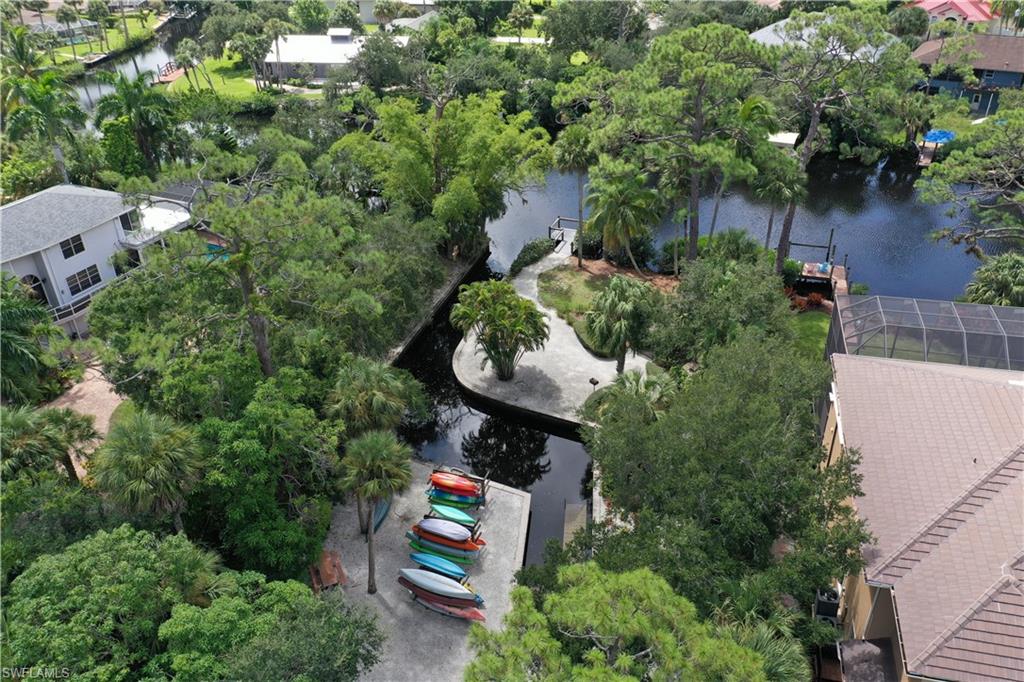 27085 Serrano Way Bonita Springs, FL 34135 - Photo 7 of 8 an aerial view of a house with a yard and outdoor seating