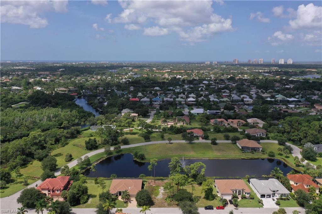 27085 Serrano Way Bonita Springs, FL 34135 - Photo 8 of 8 an aerial view of a city with lots of residential buildings