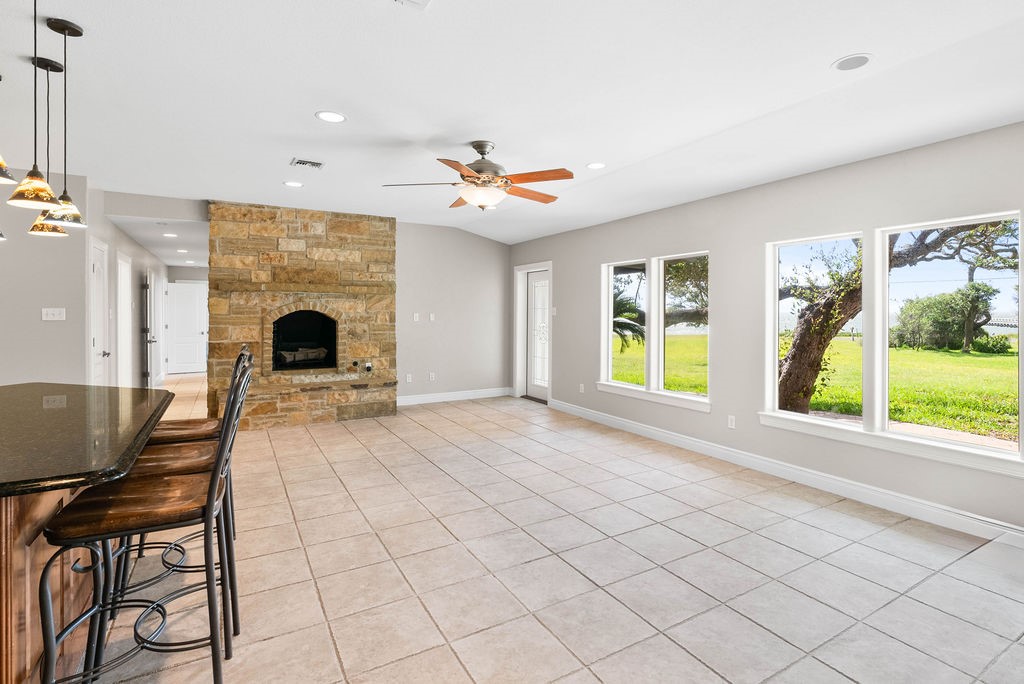 1931 North Fulton Beach Road Rockport, TX 78382 - Photo 11 of 40 a living room with furniture and a fireplace