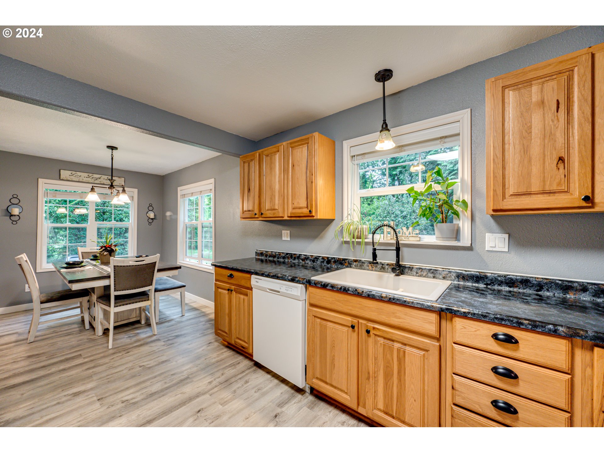 631 Clark Creek Road Longview, WA 98632 - Photo 11 of 40 a kitchen with granite countertop wooden floors and sink