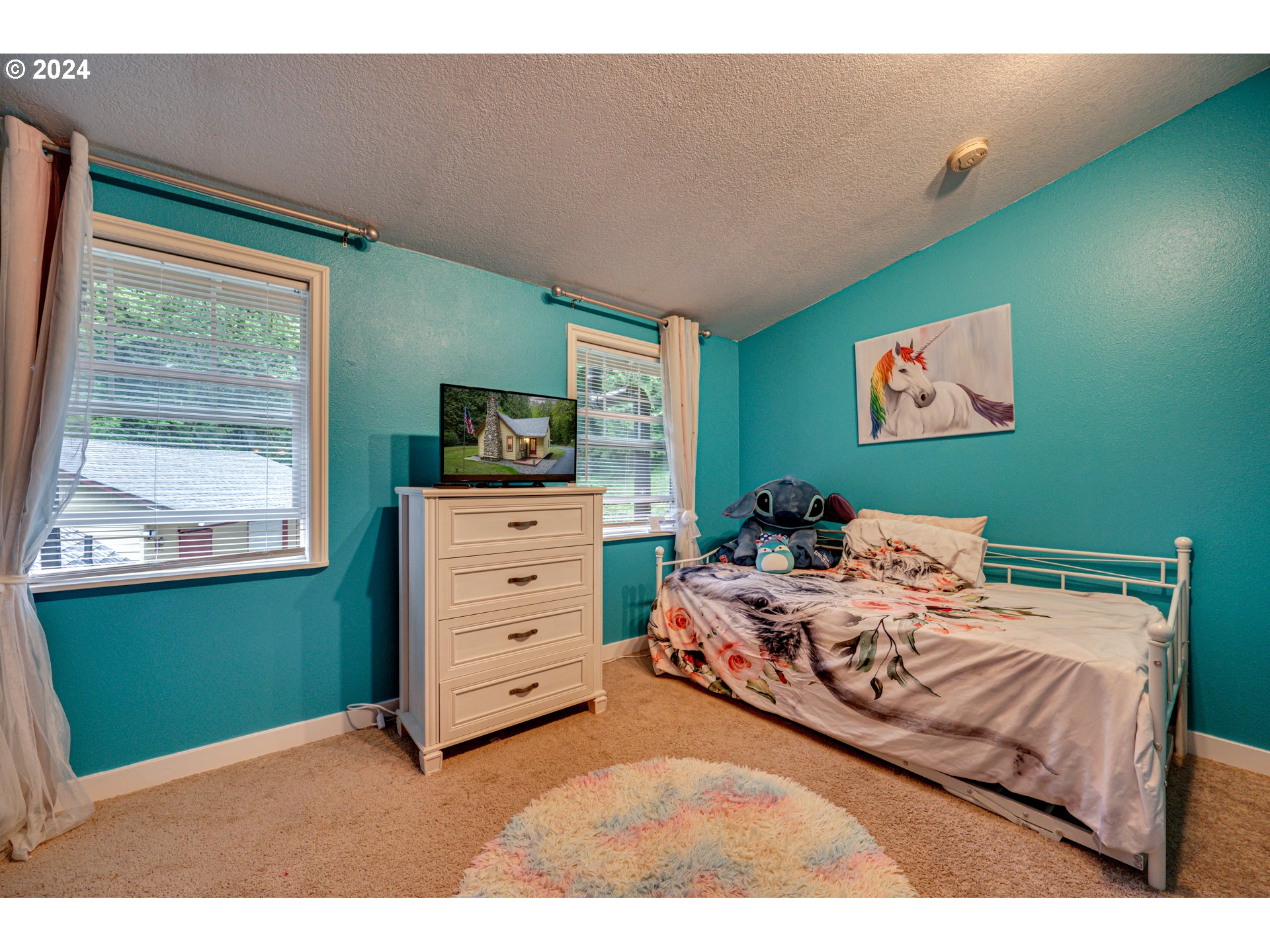 631 Clark Creek Road Longview, WA 98632 - Photo 22 of 40 a bed room with a bed and a window