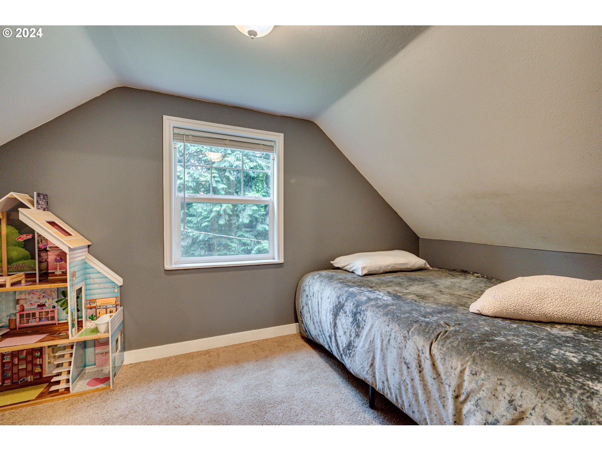631 Clark Creek Road Longview, WA 98632 - Photo 23 of 40 a bedroom with a bed and a book shelf