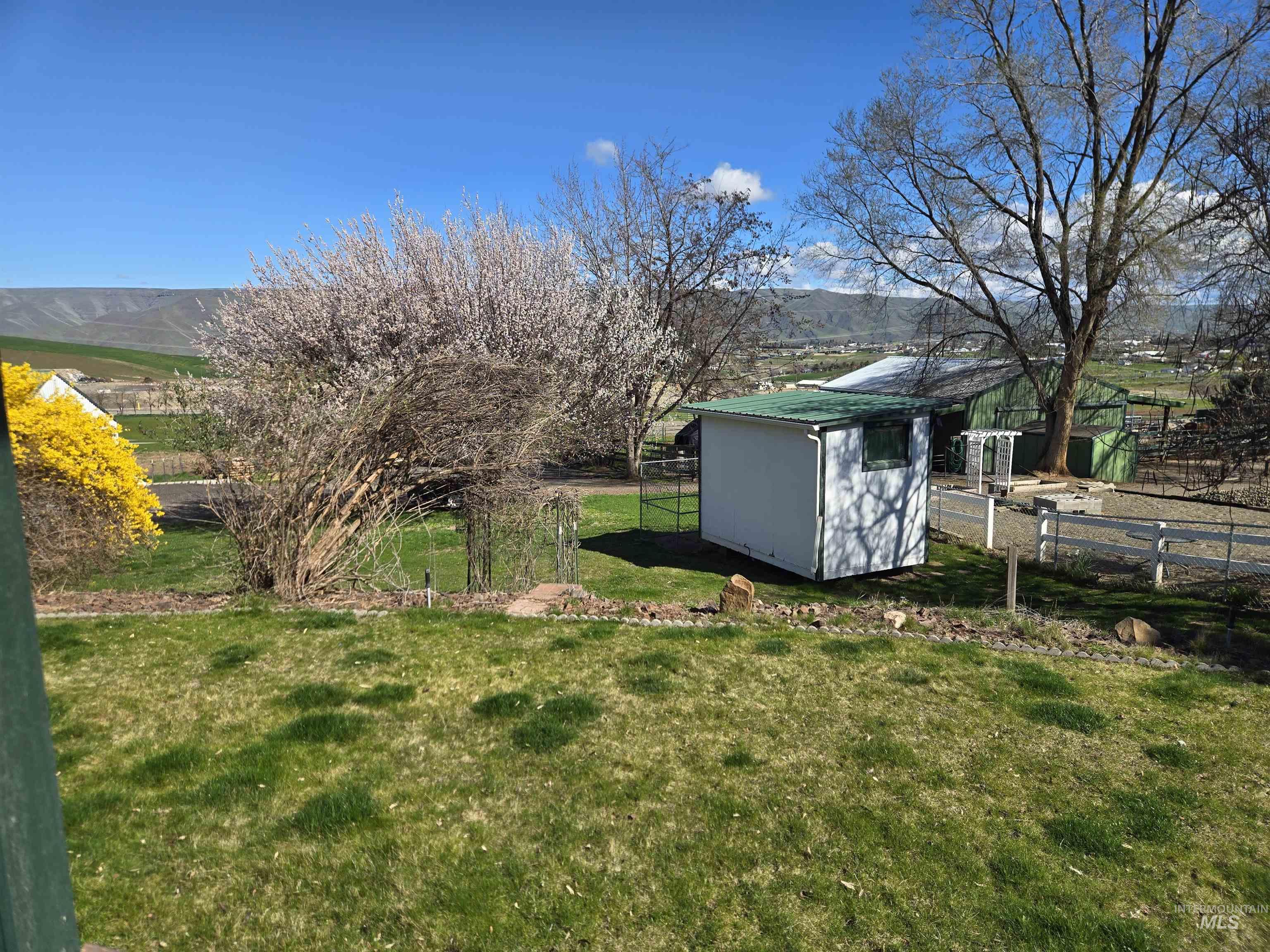 2794 9th Avenue Clarkston, WA 99403 - Photo 31 of 34 View of yard featuring a storage shed and a mountain view