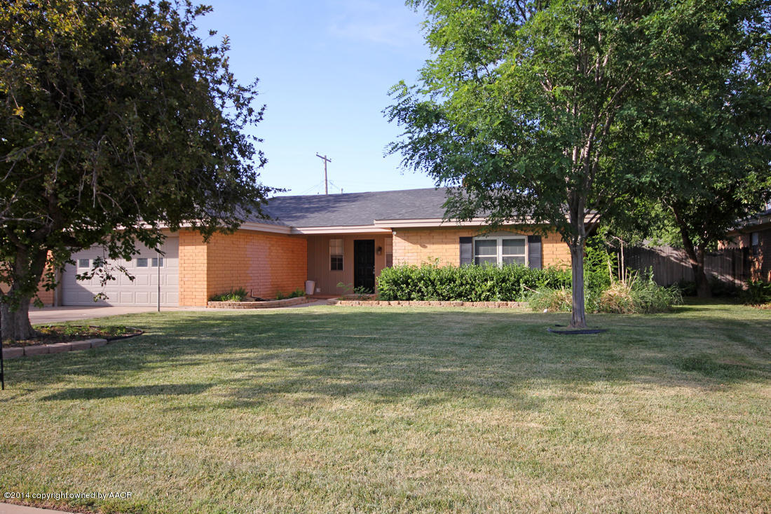 7203 Elmhurst Road Amarillo, TX 79106 - Photo 1 of 30 a front view of a house with a garden