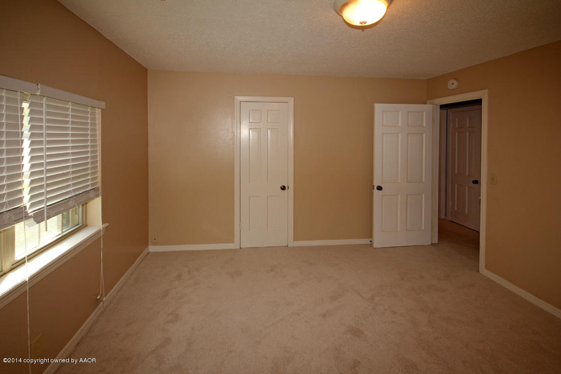 7203 Elmhurst Road Amarillo, TX 79106 - Photo 23 of 30 a view of an empty room with a window
