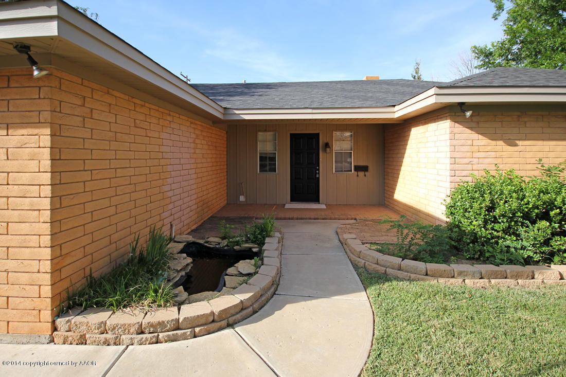 7203 Elmhurst Road Amarillo, TX 79106 - Photo 3 of 30 a front view of a house with garden