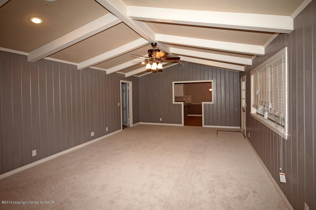 7203 Elmhurst Road Amarillo, TX 79106 - Photo 6 of 30 a view of a livingroom with a ceiling fan and window