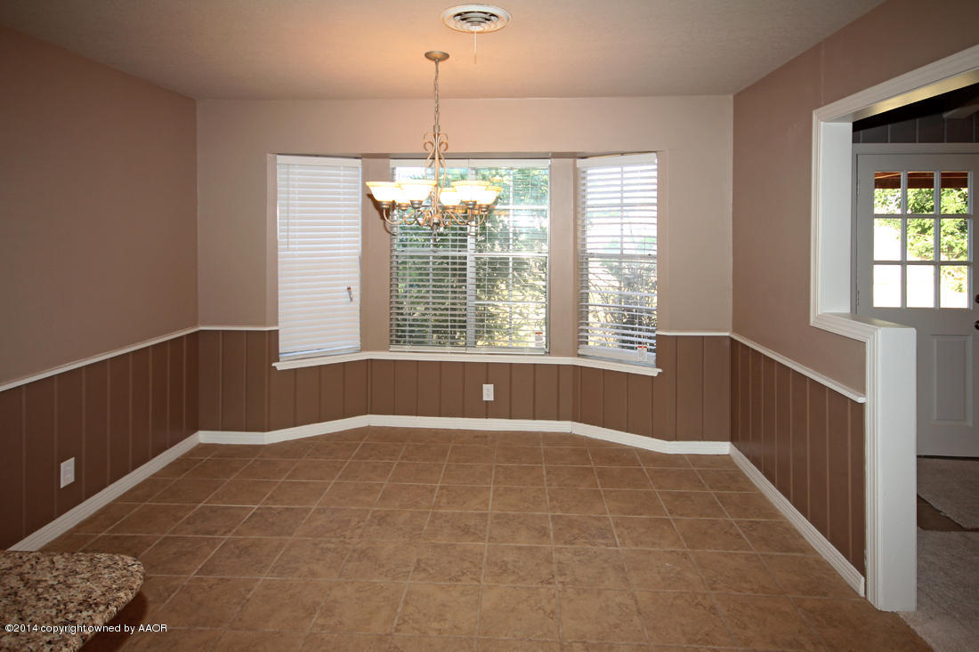 7203 Elmhurst Road Amarillo, TX 79106 - Photo 9 of 30 a view of an empty room with a window