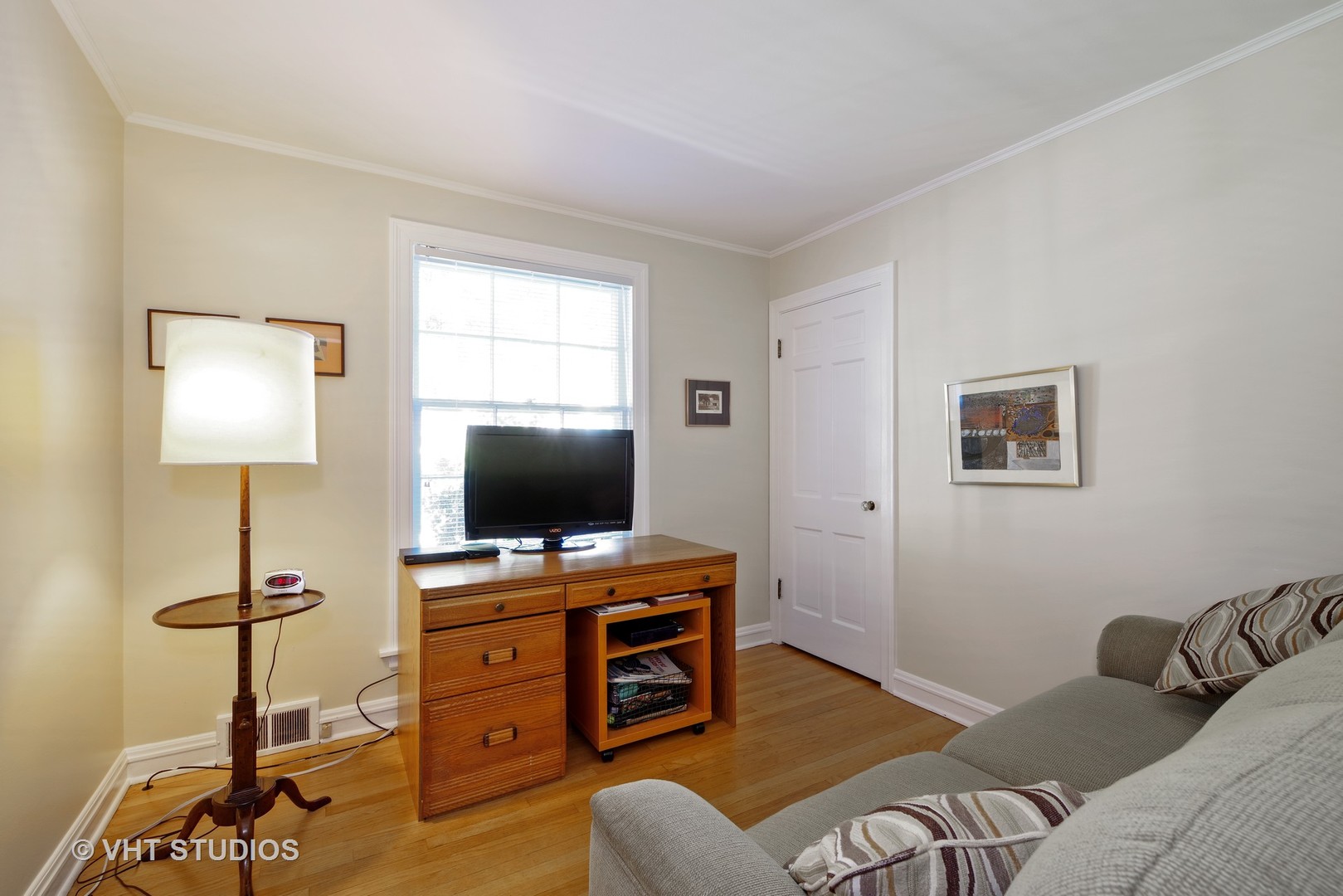 839 Indian Road Glenview, IL 60025 - Photo 8 of 13 a bedroom with furniture and a flat screen tv