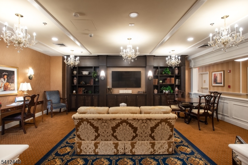 41 Springfield Avenue Summit, NJ 07901 - Photo 11 of 19 a living room with furniture and a flat screen tv