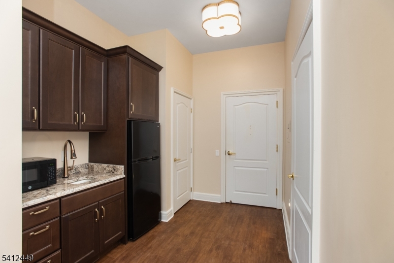 41 Springfield Avenue Summit, NJ 07901 - Photo 15 of 19 a kitchen with a refrigerator cabinet and a sink