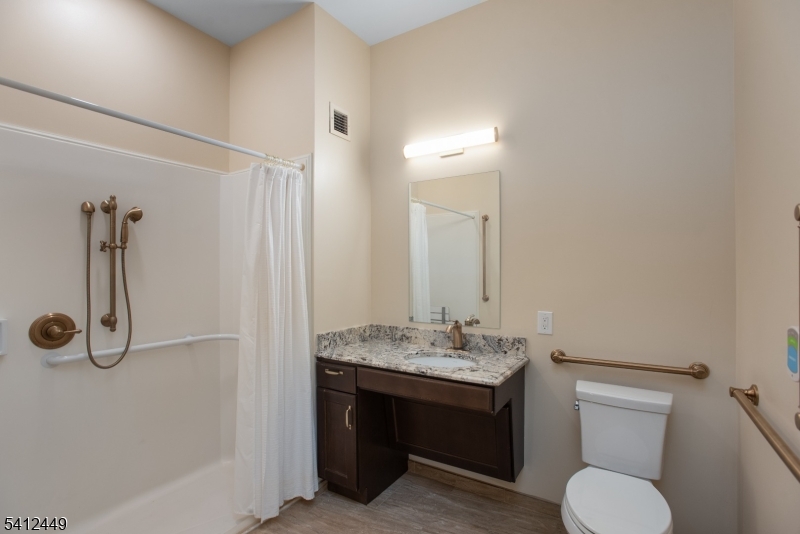 41 Springfield Avenue Summit, NJ 07901 - Photo 16 of 19 a bathroom with a sink toilet and shower