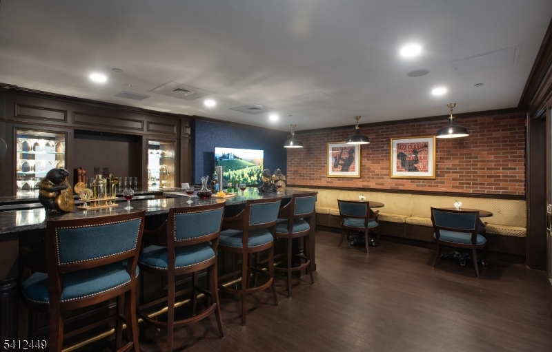 41 Springfield Avenue Summit, NJ 07901 - Photo 9 of 19 a room with lots of wooden furniture and glass windows