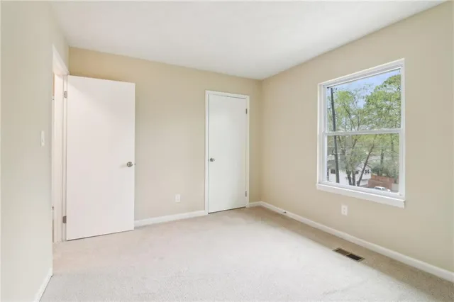 an empty room with windows