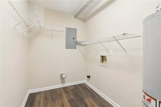 a small space with wooden floor and a window