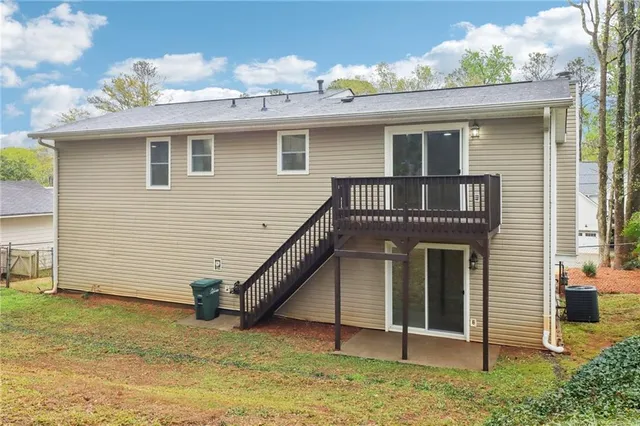 a view of a house with wooden floor and a fence