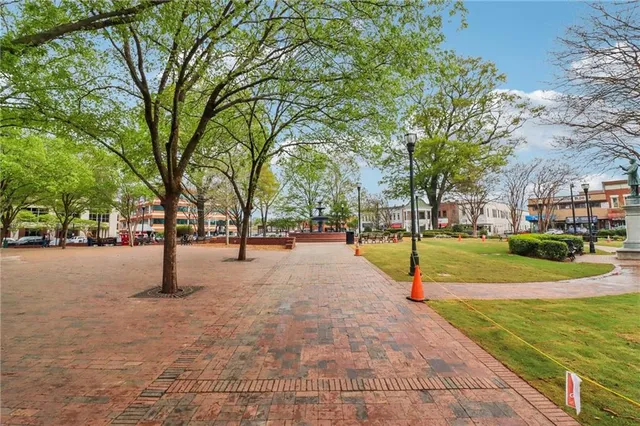a view of a building with car parked