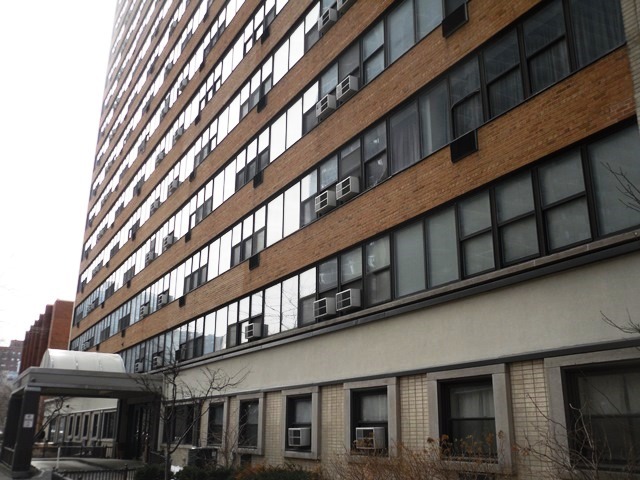 6030 North Sheridan Road, Unit 1604 Chicago, IL 60660 - Photo 1 of 6 a large building with a large windows