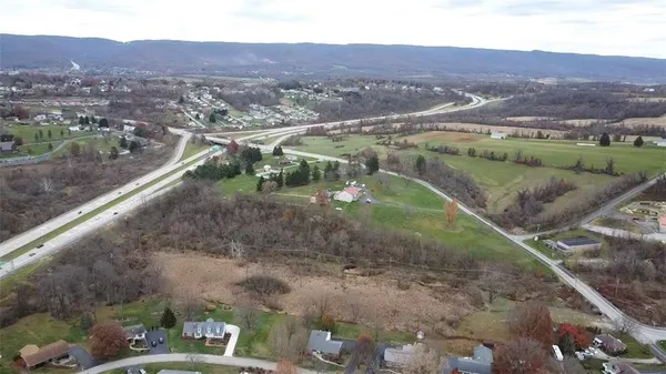 a view of a street with a mountain in the background