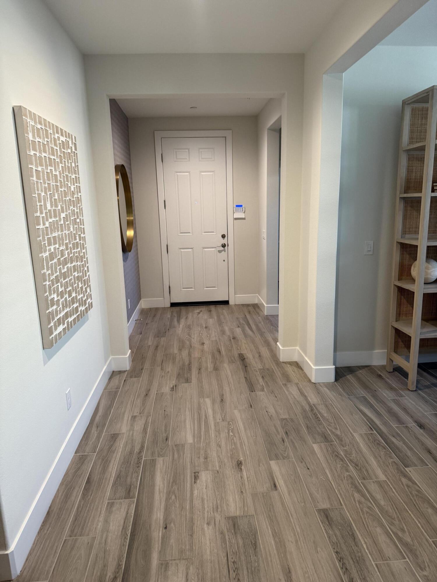 39912 Felicita Parkway Palm Desert, CA 92211 - Photo 11 of 32 an empty room with wooden floor and closet