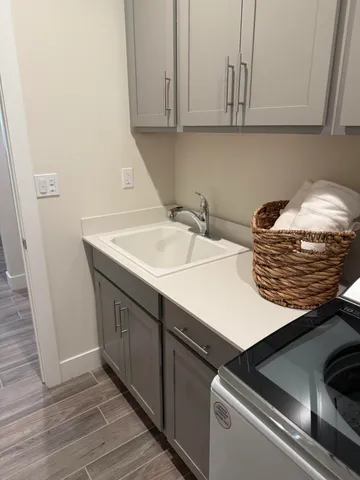 a kitchen with a sink and cabinets