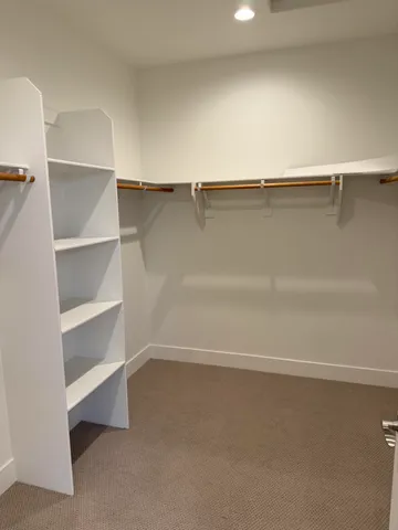 a view of an empty walk in closet
