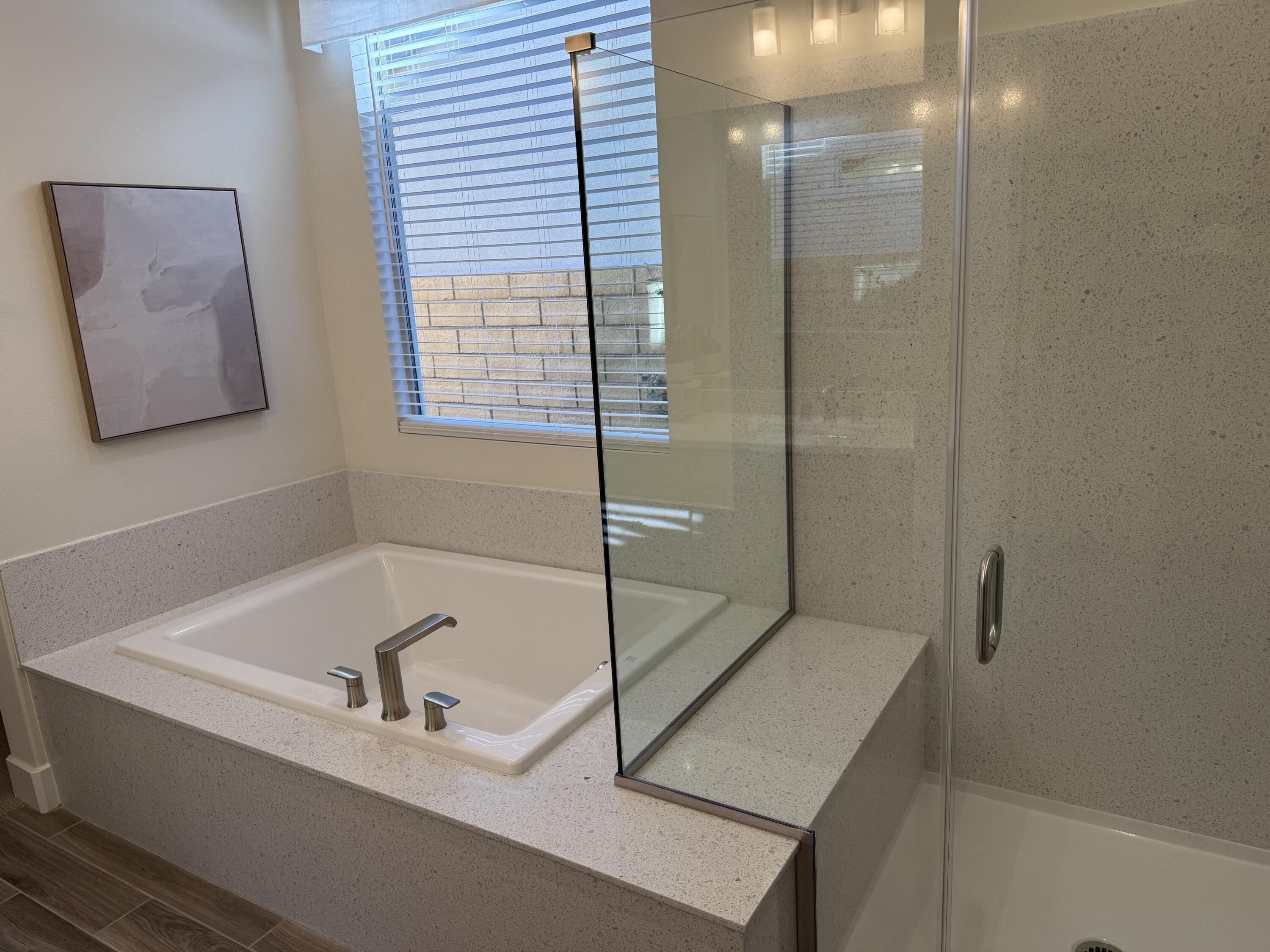 39912 Felicita Parkway Palm Desert, CA 92211 - Photo 23 of 32 a bathroom with a bathtub and shower