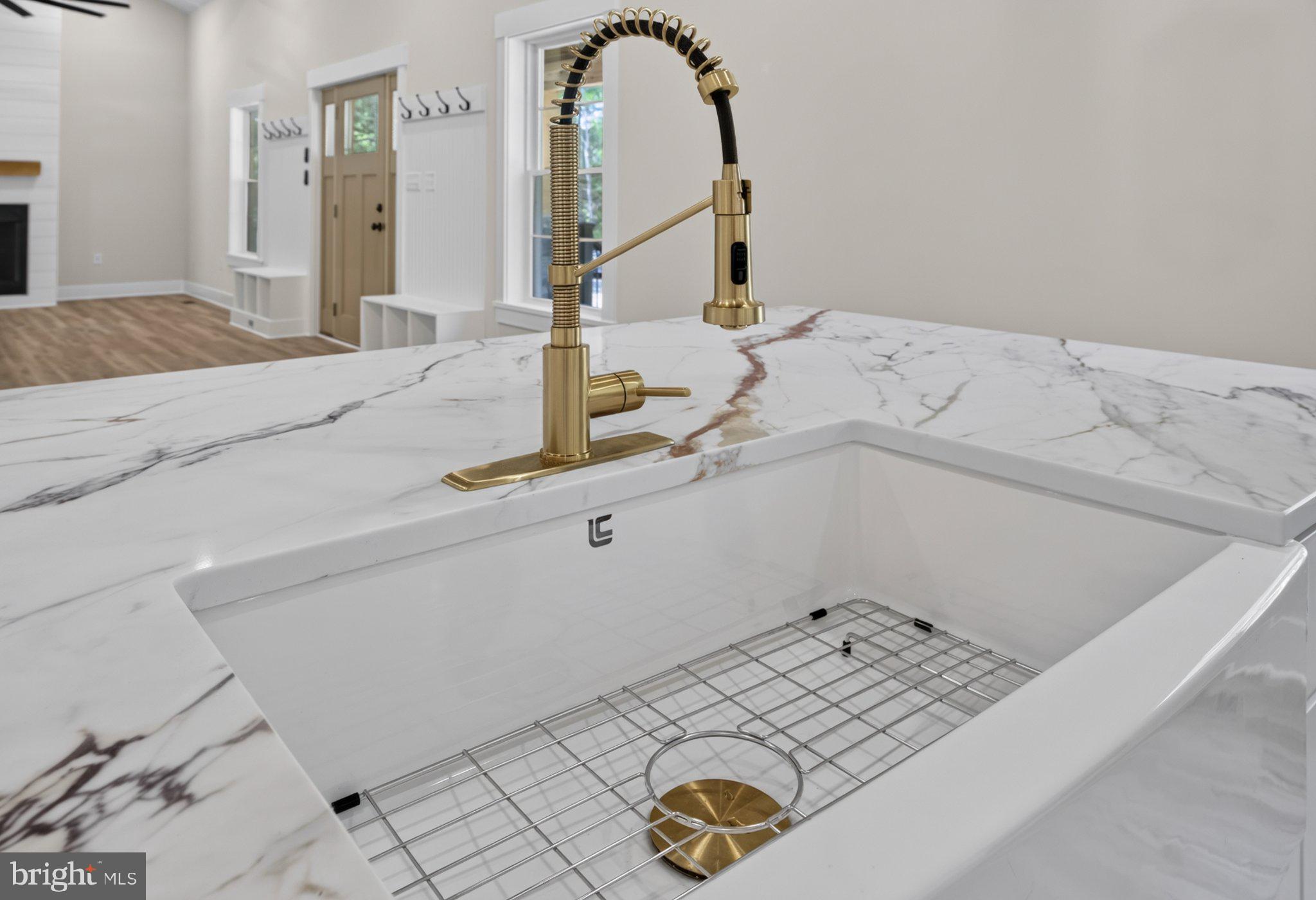 972 Days Bridge Road Mineral, VA 23117 - Photo 74 of 109 Sleek marble sink with gold accents.
