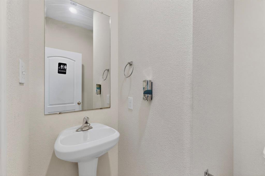 148 Point Rider Road Newark, TX 76071 - Photo 14 of 40 Half bath featuring a textured wall
