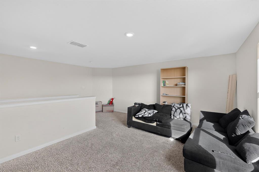 148 Point Rider Road Newark, TX 76071 - Photo 17 of 40 Living area with carpet and recessed lighting
