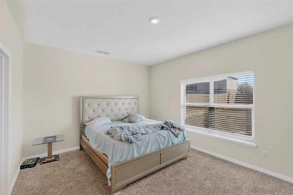 148 Point Rider Road Newark, TX 76071 - Photo 18 of 40 Bedroom featuring baseboards and carpet