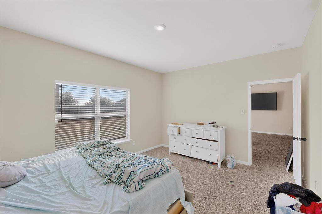 148 Point Rider Road Newark, TX 76071 - Photo 19 of 40 Bedroom with baseboards and carpet floors