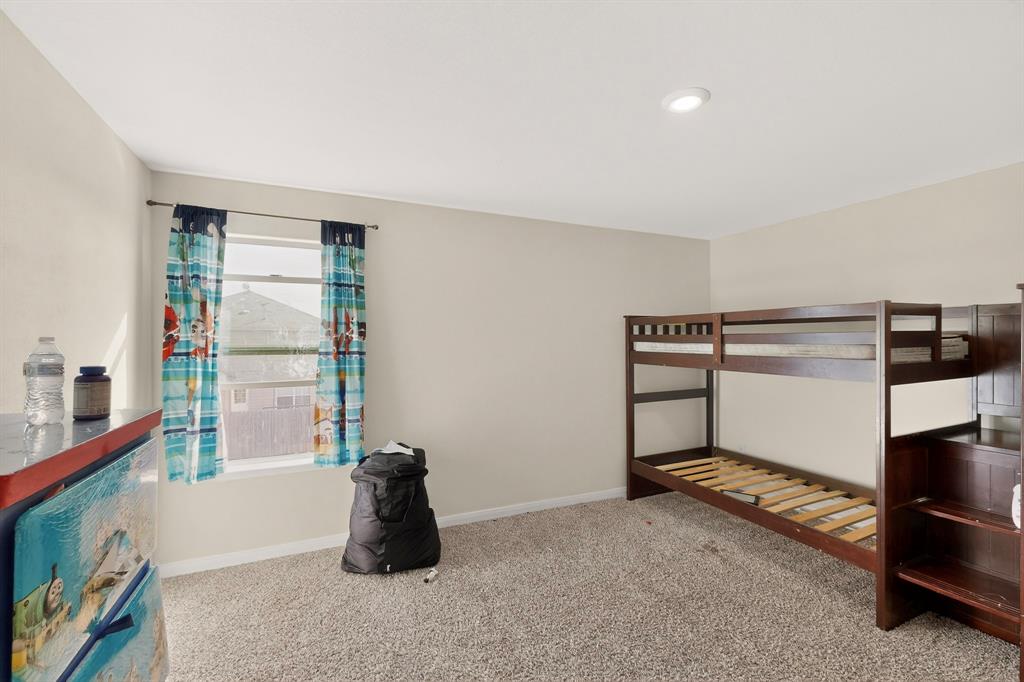 148 Point Rider Road Newark, TX 76071 - Photo 24 of 40 Unfurnished bedroom with baseboards and carpet floors