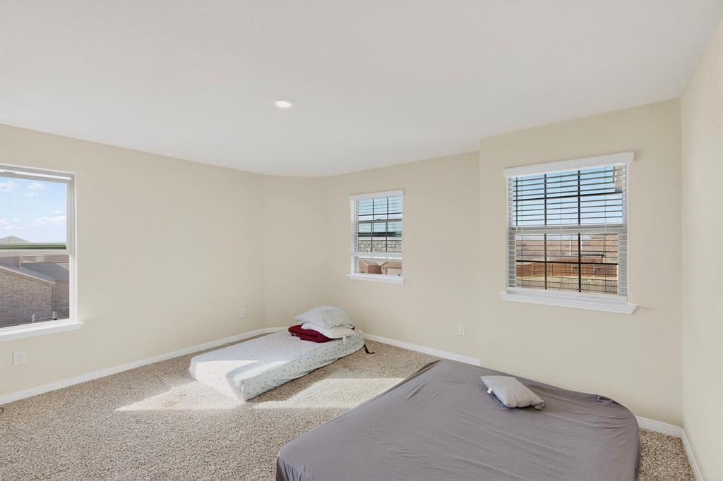 148 Point Rider Road Newark, TX 76071 - Photo 27 of 40 Carpeted bedroom featuring baseboards and recessed lighting