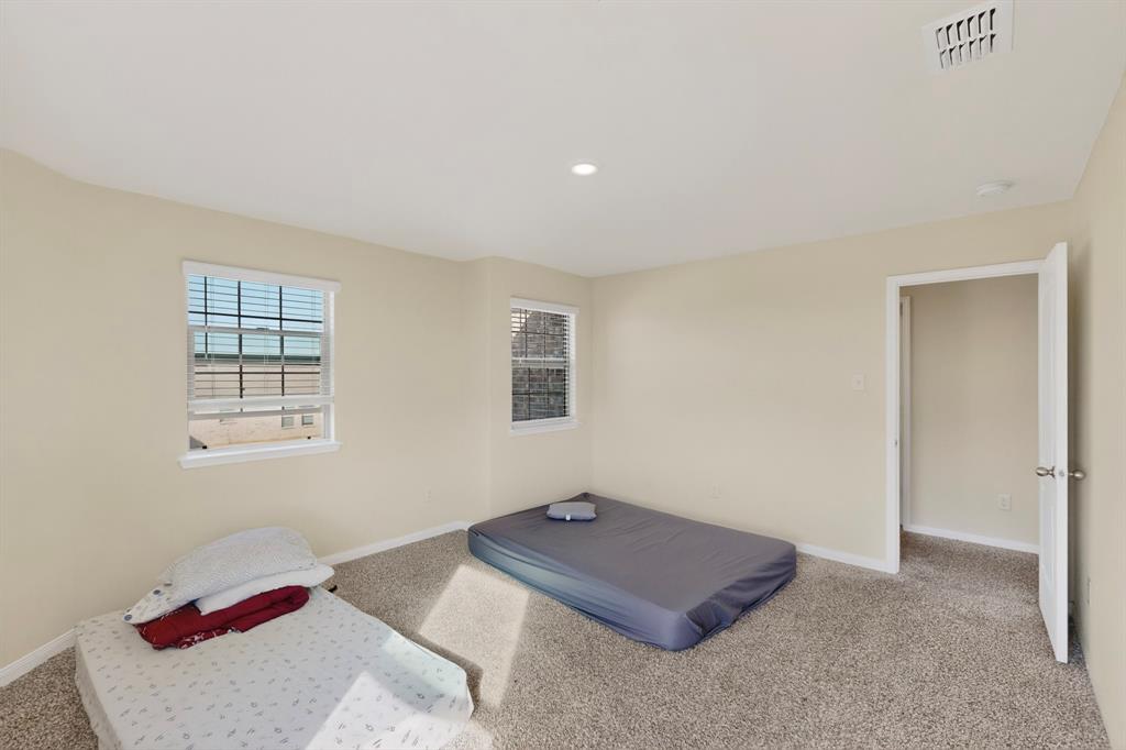 148 Point Rider Road Newark, TX 76071 - Photo 28 of 40 Unfurnished bedroom featuring carpet floors and recessed lighting