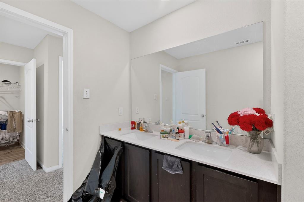 148 Point Rider Road Newark, TX 76071 - Photo 30 of 40 Full bathroom featuring double vanity, light colored carpet, and ensuite bath