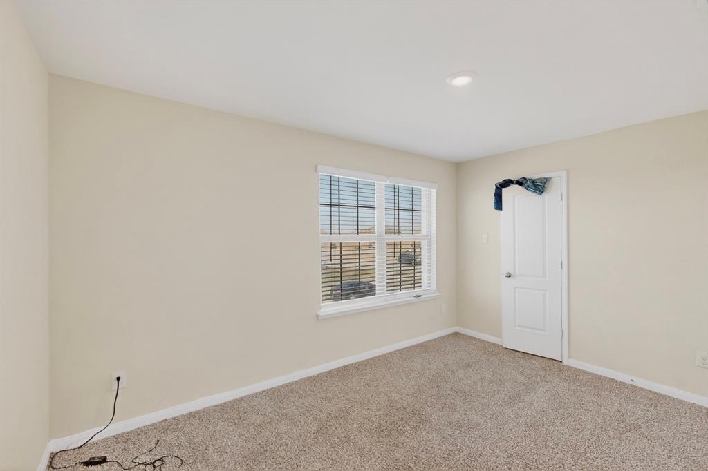 148 Point Rider Road Newark, TX 76071 - Photo 33 of 40 Carpeted empty room with baseboards