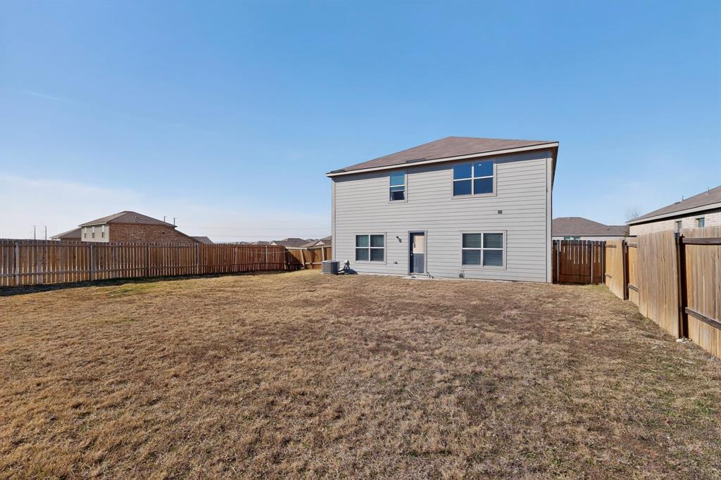 148 Point Rider Road Newark, TX 76071 - Photo 38 of 40 Back of property featuring a fenced backyard