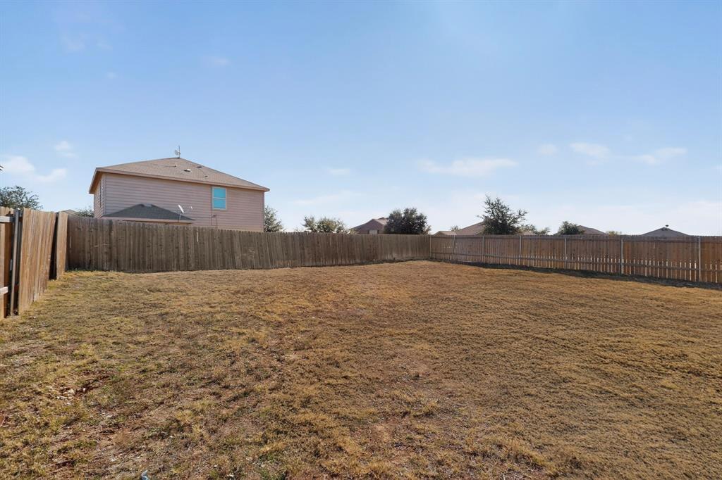 148 Point Rider Road Newark, TX 76071 - Photo 39 of 40 View of fenced backyard