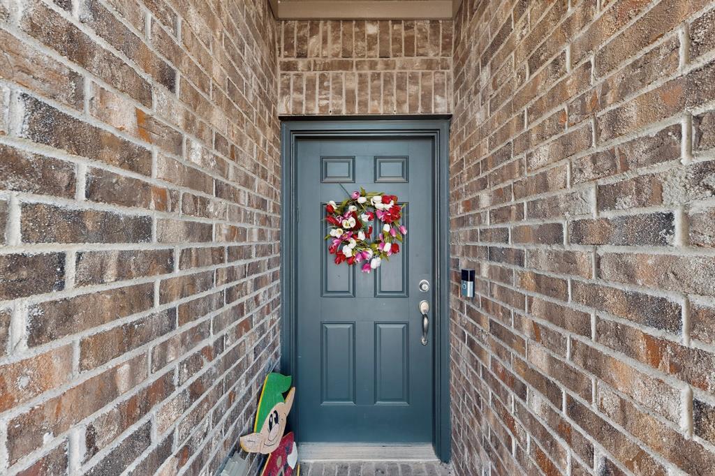148 Point Rider Road Newark, TX 76071 - Photo 5 of 40 Entrance to property featuring brick siding