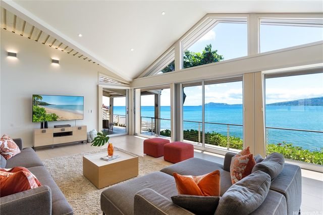 a bedroom with a large bed and a balcony view