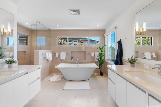 a kitchen with a dining table chairs and white appliances