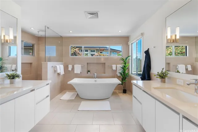 a kitchen with a dining table chairs and white appliances