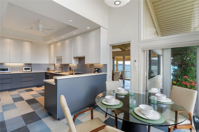 an aerial view of multiple houses with a yard