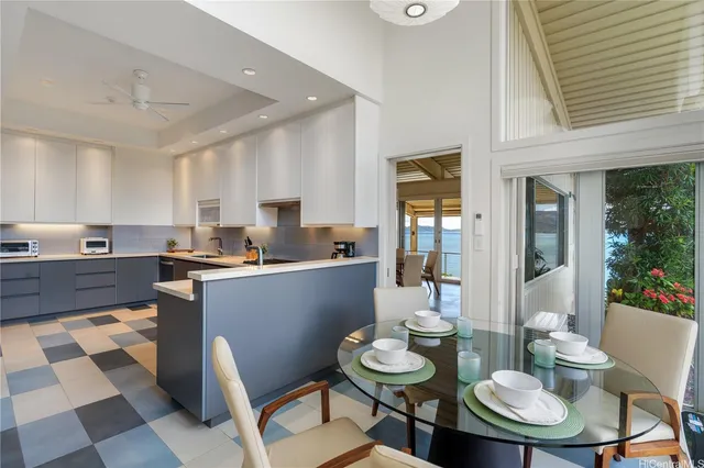 an aerial view of multiple houses with a yard