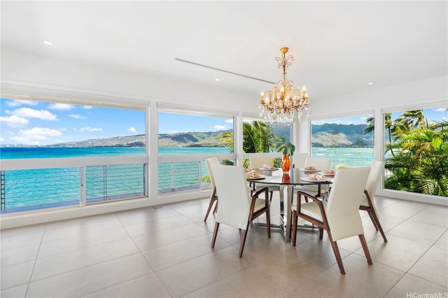 a bedroom with furniture and large window